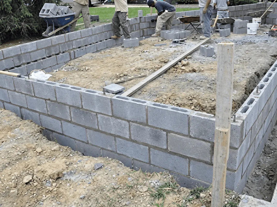 Professionals building a foundation with blocks in Wichita, KS