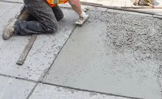 Professional repairing a concrete floor in Wichita, KS